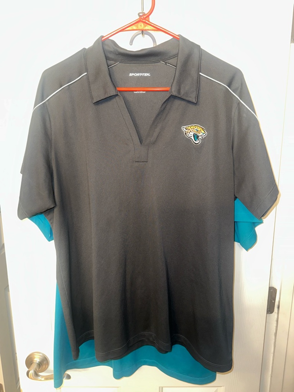 Sport-Tek Jacksonville Jaguars grey and teal polos for women.